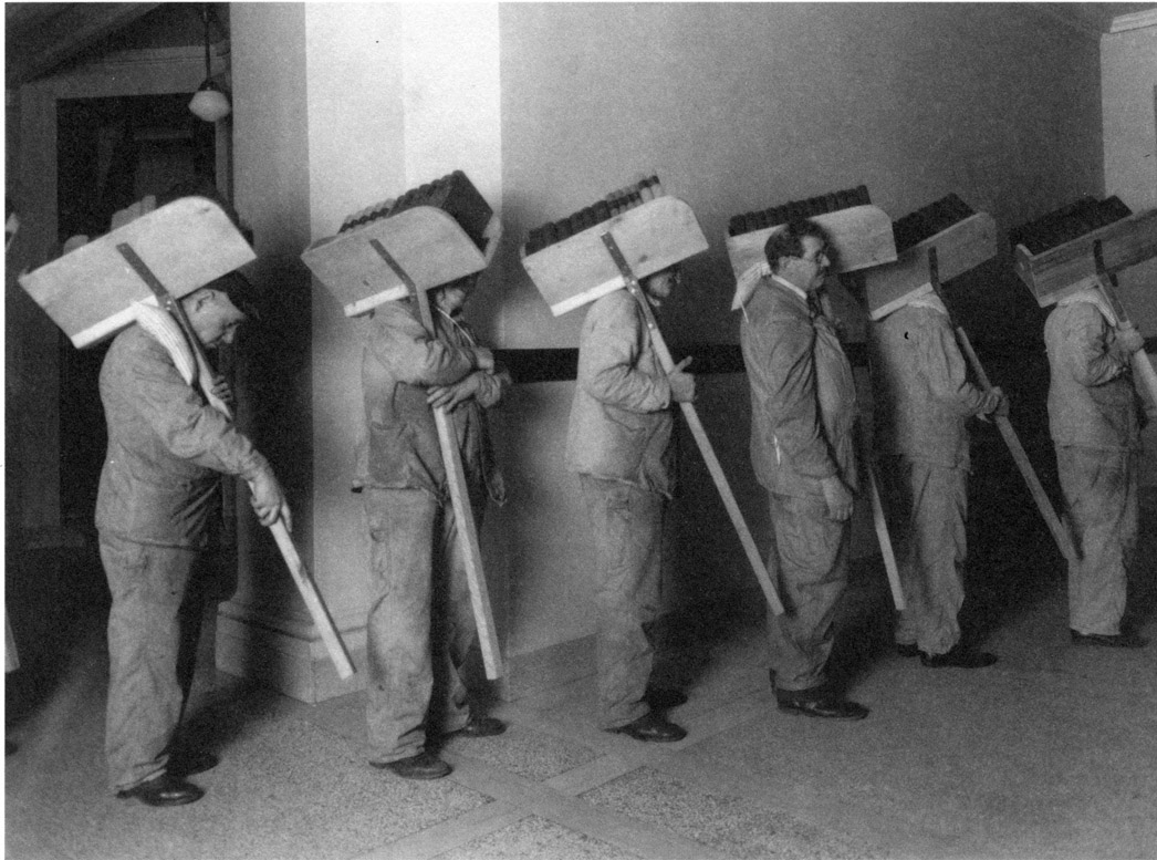 Workers move books to the new library in Welch Hall