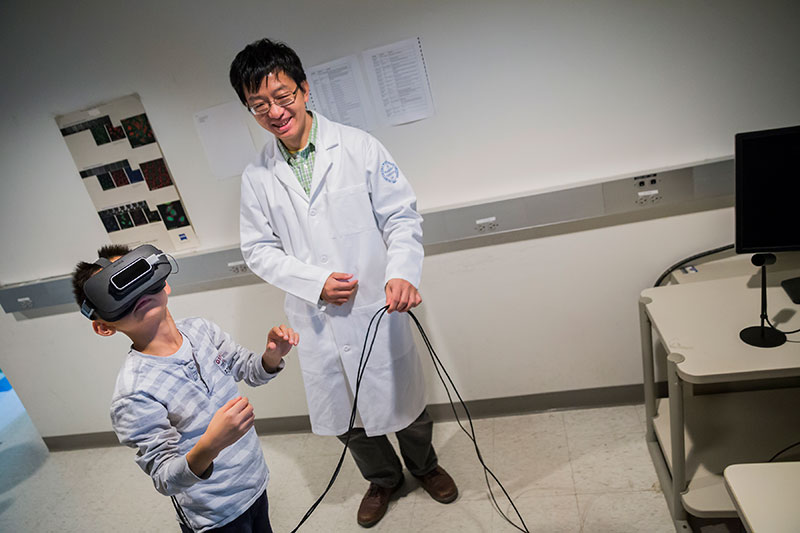 Virtual reality goggles give scientists a tool to explore biological samples in three dimensions. The exhibit was part of the Bio-Imaging Resource Center tour.