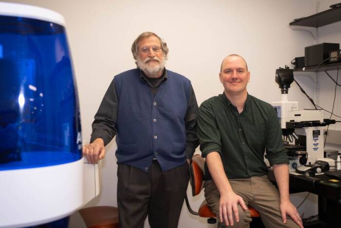 Jeffrey V. Ravetch stands at left and Andrew T. Jones at right