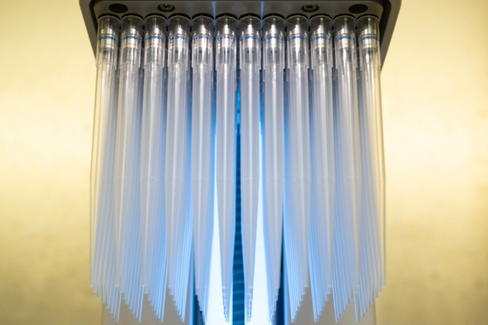 An electronic 96-channel pipette used in 7,000 parallel experiments that uncovered more than 100 bNAb escape mutations across 15 viral strains.