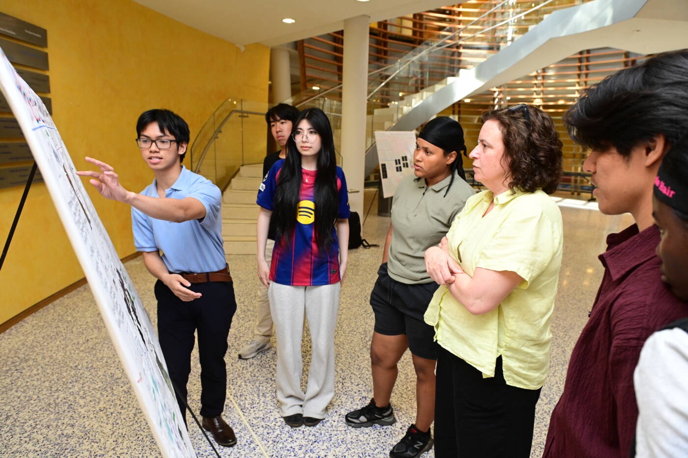 The program culminates in an annual poster session in June where students share their research. 