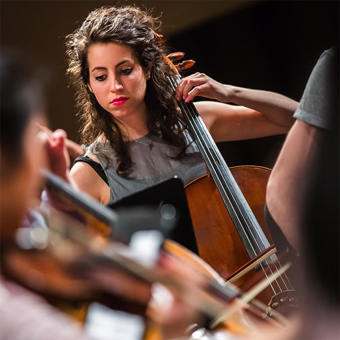 A cellist performs in one of the Peggy Rockefeller concerts
