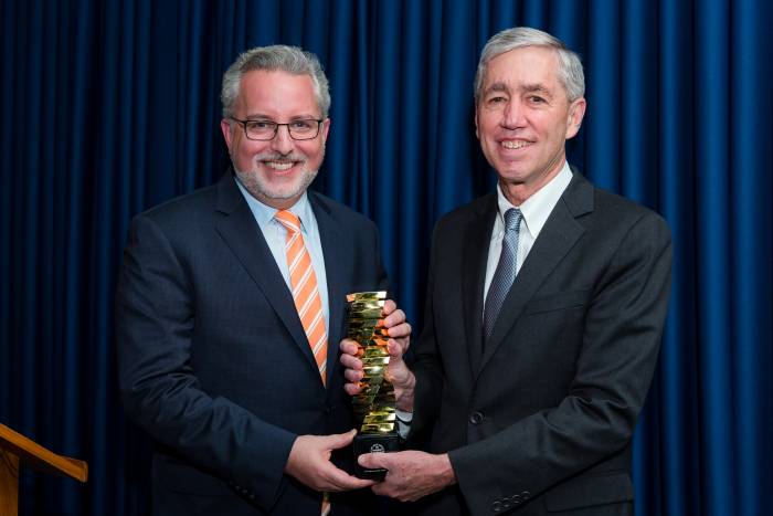 9. Evan Sohn (left) accepting the Enlightened Philanthropy Award from Rick Lifton (right)