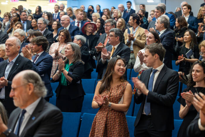 Honoree Robin Chemers Neustein receives a standing ovation in Caspary Auditorium