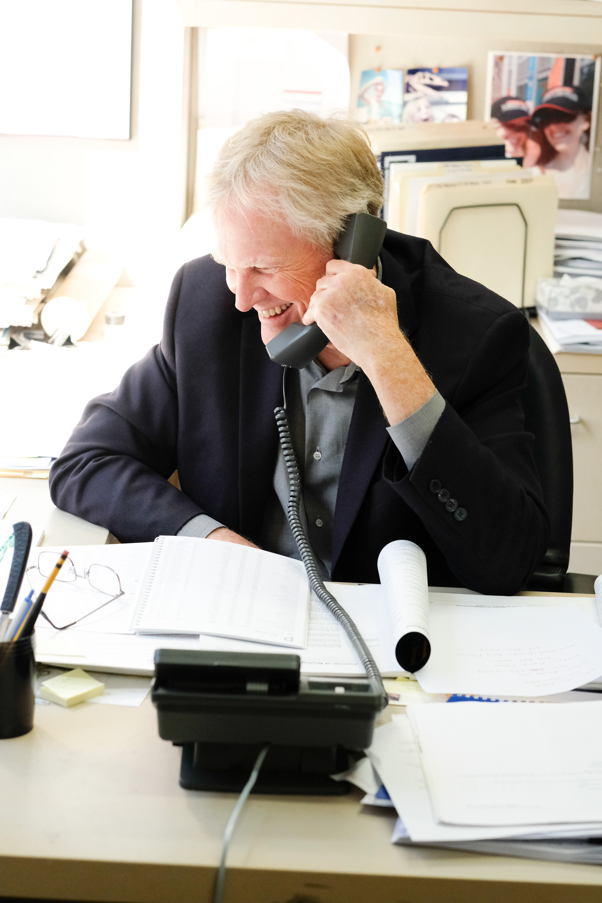 Young smiles as he takes one of many calls after the Nobel announcement.