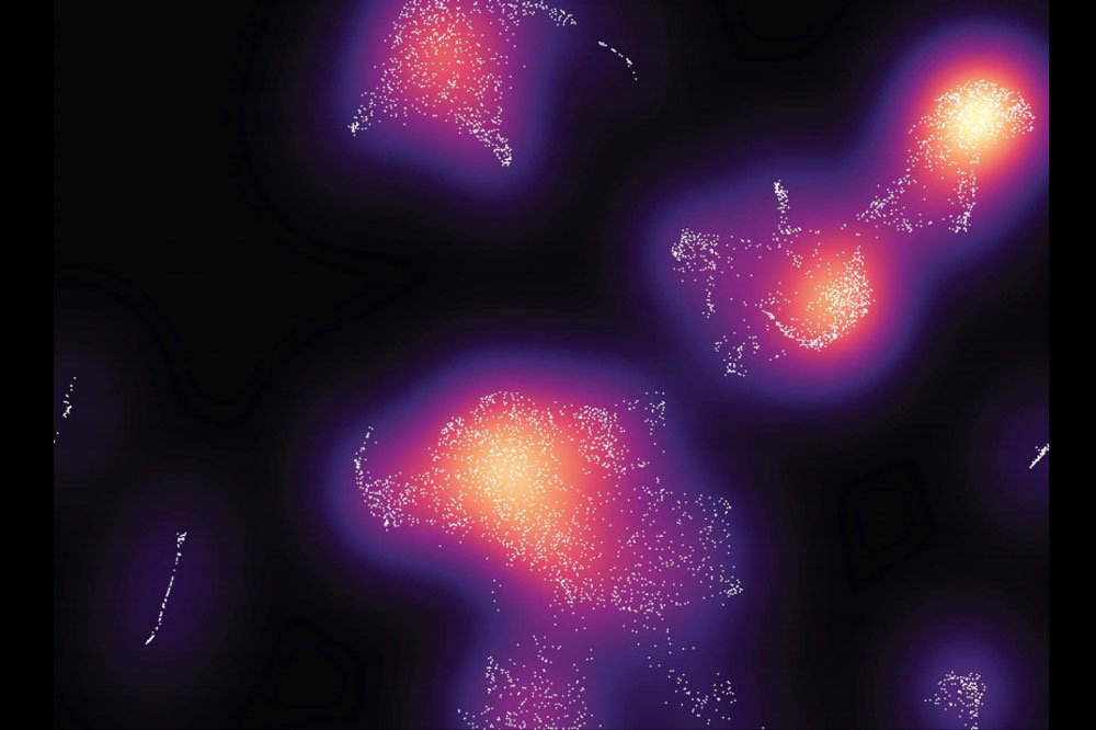 Clusters of immune cells appear orange, red, and purple against black
