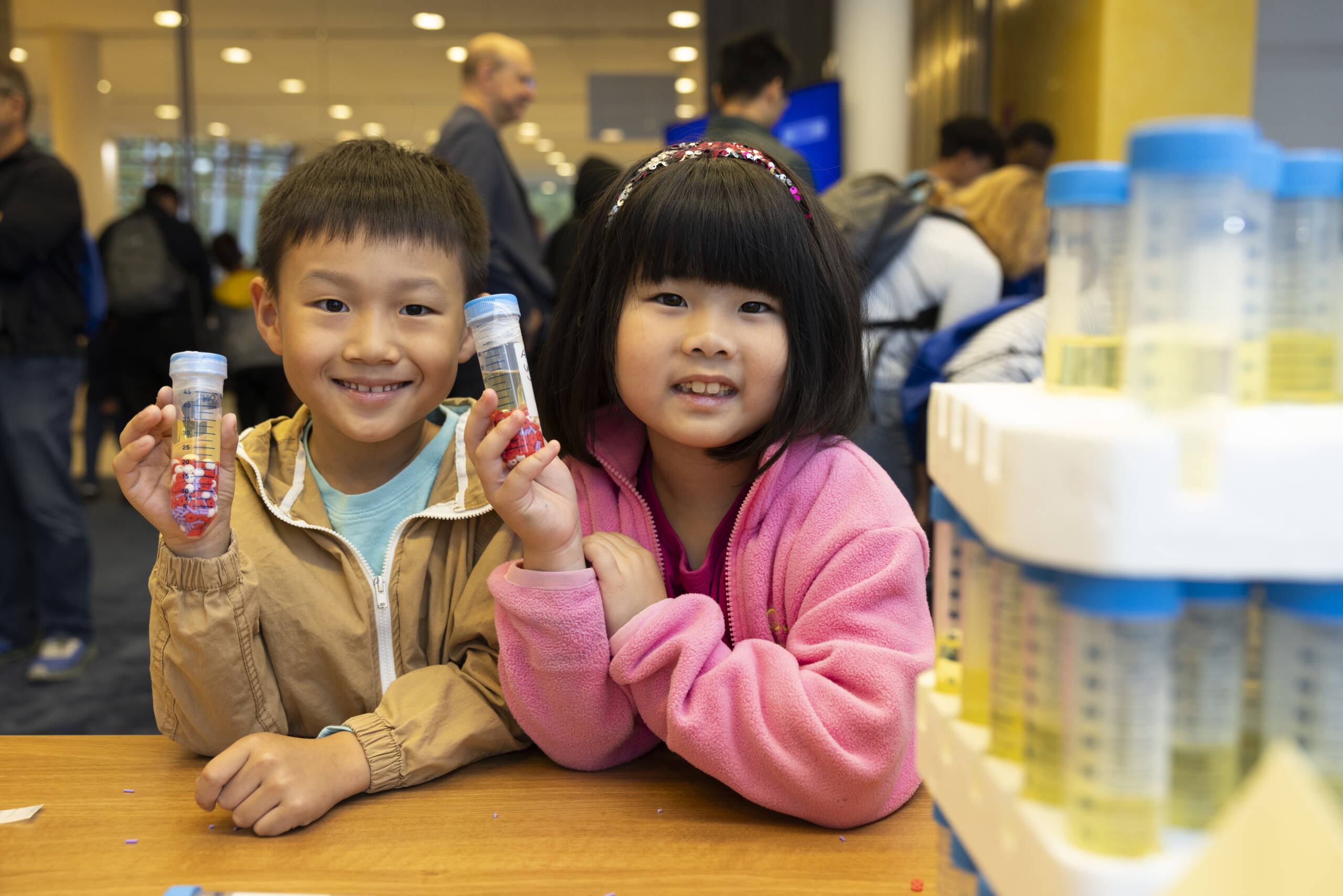 A boy and girl learn how the circulatory system work by building model blood.