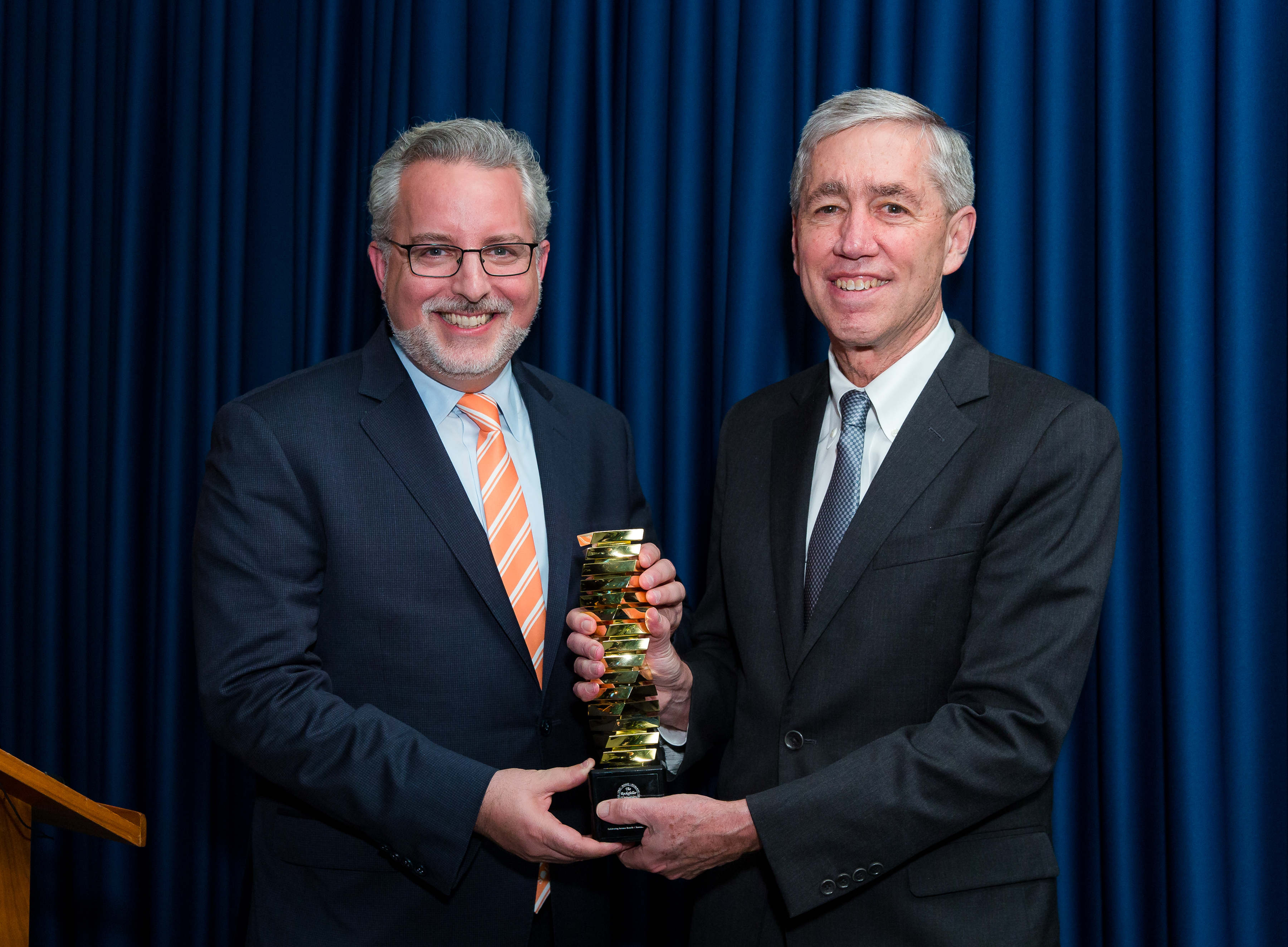 9. Evan Sohn (left) accepting the Enlightened Philanthropy Award from Rick Lifton (right)