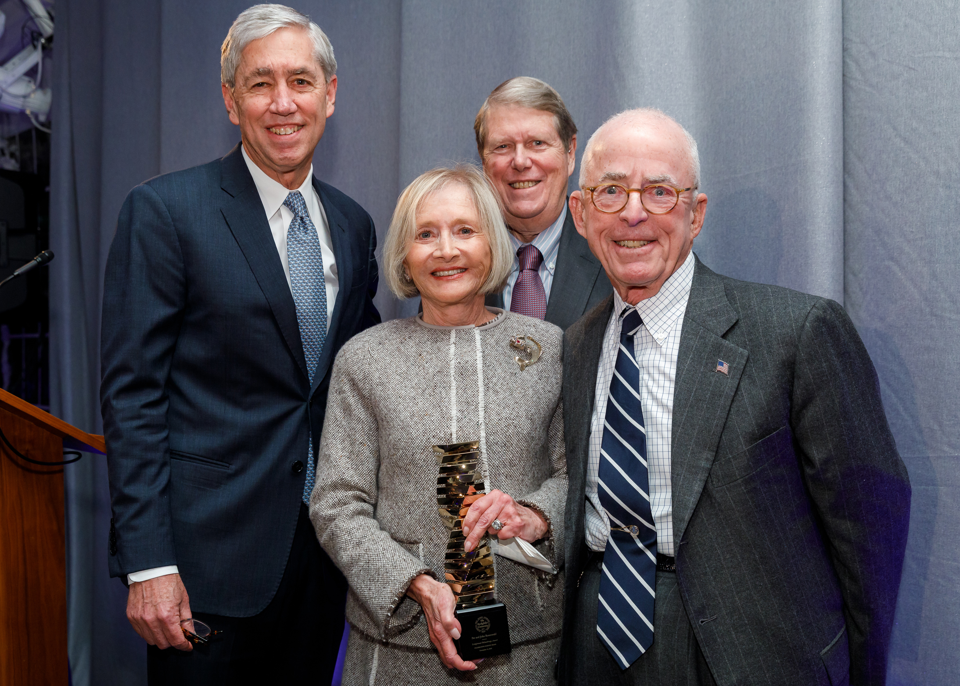Pat and John Rosenwald (front) accepting the 2018 Enlightened Philanthropy Award from Rick Lifton (back left) and Russ Carson