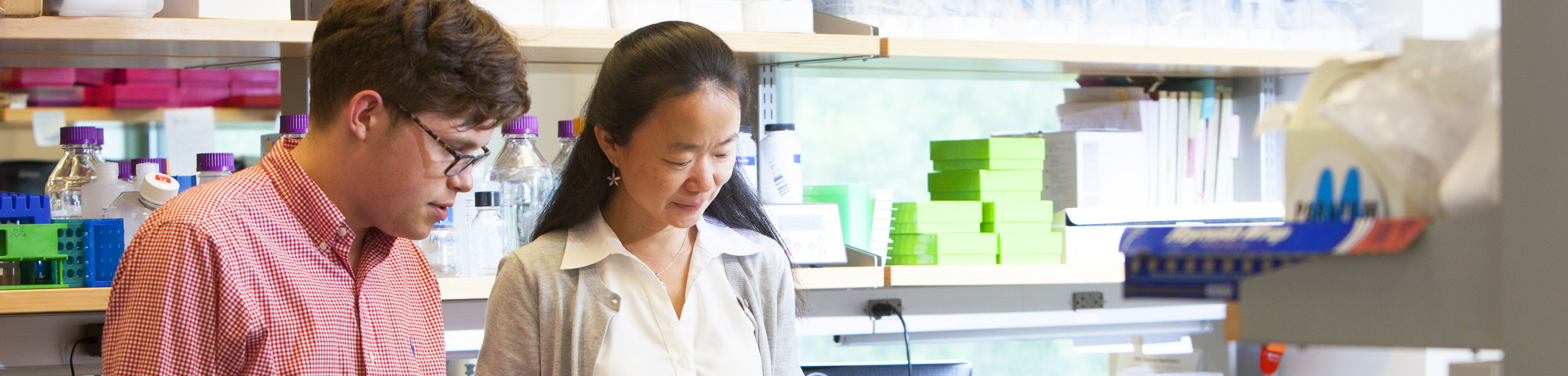 Jue Chen and Anthony Palillo talking in lab